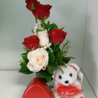 Cream and red rose arrangement with heart tin of sweets and teddy bear