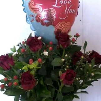 Arrangement of red roses with "Love You" balloon